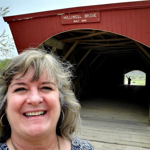 Sheila in front of Holliwell Bridge in Madison County